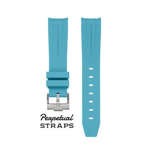 May include: Two light blue watch straps with a silver buckle. The straps are made of a flexible material and feature a textured design. The text "Perpetual STRAPS" is printed at the bottom.