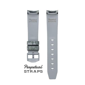 May include: Two gray watch straps with the text "Perpetual STRAPS". One strap has a camouflage pattern in shades of green and gray. The other strap has a series of holes for adjustment. The buckle is silver.