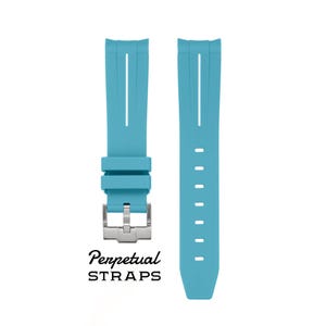 May include: Two-piece turquoise watch strap with a silver-tone buckle. The strap has vertical grooves and a series of holes for adjustment. The text "Perpetual STRAPS" is printed in black cursive font.