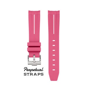 May include: Two bright pink watch straps with a silver clasp. The straps have a textured design with a central groove and the text "Perpetual STRAPS" in black.