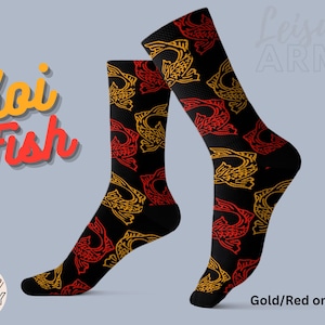 May include: A pair of black socks with a gold and red koi fish pattern. The socks have the text "Leisure Army" on the top of the socks and the text "Koi Fish" on the left side of the image. The text "Gold/Red on Black" is at the bottom right of the image.