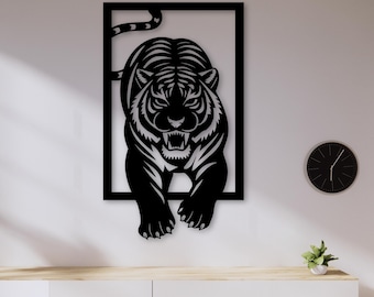May include: Black metal wall art of a tiger in a rectangular frame. The tiger is depicted in a dynamic pose, with its mouth open, revealing its teeth. The artwork includes the text: .SVG .DXF .EPS .PNG .PDF.