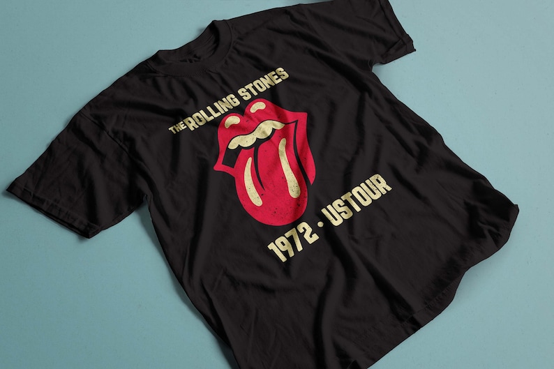 May include: Black t-shirt with a vintage-style graphic of The Rolling Stones tongue logo and the text "1972 - USTOUR".