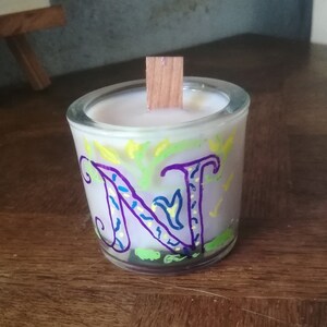 Organic scented candle with intention of the. violet flame