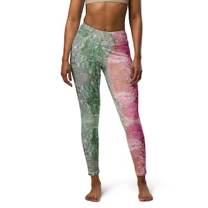 May include: A pair of leggings with a green and pink abstract print. The leggings are made of a stretchy, comfortable fabric and are perfect for yoga, running, or any other workout.
