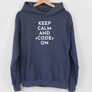 May include: A navy blue hoodie with a white graphic that reads "Keep Calm and <CODE> ON".