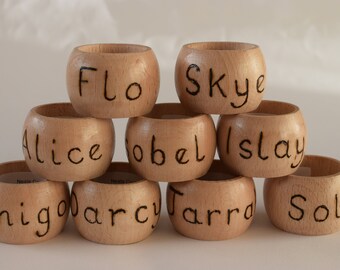 Set of two personalised wooden napkin rings. Hand worked in pyrography