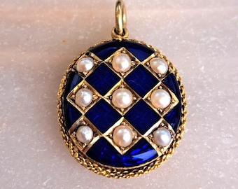 An 18ct yellow gold, seed pearl and enamel mourning locket pendant