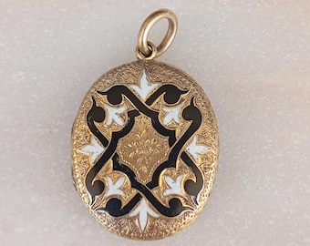 An antique rolled gold and enamel memento mori locket