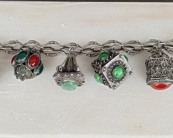 An .800 Silver Vintage Etruscan Revival Charm Bracelet