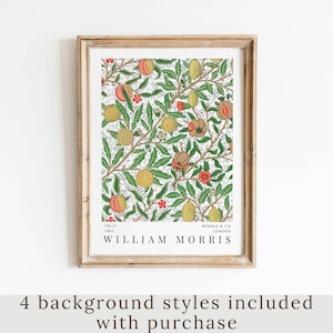 May include: A framed print of a vintage botanical illustration featuring a repeating pattern of pomegranates, lemons, and leaves. The print is titled "Fruit 1862" and "William Morris" with the text "Morris & Co London" below.