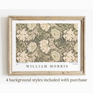 May include: A framed print of a vintage floral pattern with a white background and green and brown accents. The print features the text "Chrysanthemum 1877" and "William Morris" in the bottom left corner and "Morris & Co London" in the bottom right corner.