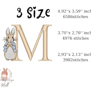 May include: Embroidery design of the letter M with a Peter Rabbit character in the lower left corner. The design is available in three sizes: 4.92 x 3.59 inches, 3.70 x 2.70 inches, and 2.93 x 2.13 inches.