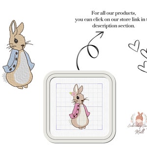 May include: Embroidery design of a brown rabbit wearing a blue jacket with white buttons. The rabbit is standing on a white grid background. The text "Embroidery Design Mall" is in the lower right corner of the image.