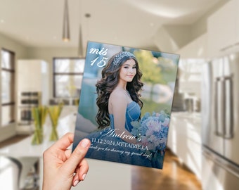 May include: A blue and white quinceañera invitation with a photo of a young woman wearing a blue dress and a tiara. The text on the invitation reads "mis 15 Andrew's 11.12.2024, METAIRIE LA thank you for sharing my special day!"
