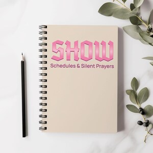 Puede incluir: Una libreta de espiral rosa con la palabra "SHOW" en letras rosas con efecto degradado. El texto "Schedules & Silent Prayers" está debajo de la palabra "SHOW".