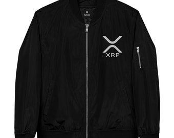 May include: Black bomber jacket with a zip fastening and a silver XRP logo on the front. The jacket has a size tag that says "M" on the inside.