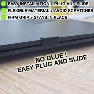 Puede incluir: Un portátil negro con una pieza de plástico negro unida al lateral. El texto "NO GLUE! EASY PLUG AND SLIDE" está escrito en blanco sobre una superficie de madera.