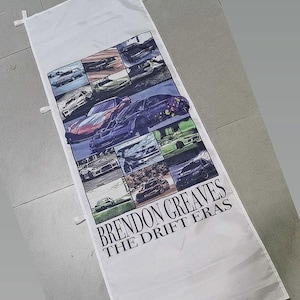 May include: White rectangular banner featuring a collage of colorful sports cars. The banner has the text "BRENDON CREAVES THE DRIFT ERAS" in black. The cars are in various colors and styles, set against a dark background.