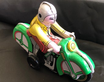 Vintage tin motorcyclist, wind-up toy with key.