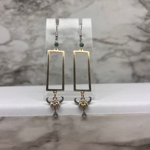 Gold and Silver western dangle earrings with cow detail