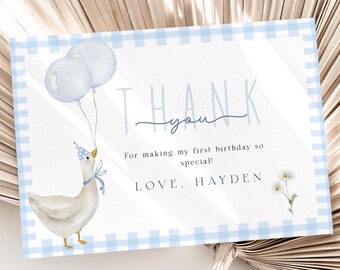 May include: A blue and white gingham thank you card with a watercolor illustration of a goose wearing a party hat and holding blue balloons. The text on the card reads "Thank you" and "For making my first birthday so special! Love, Hayden."