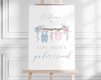 May include: A gender reveal sign with a watercolor floral design. The sign says "Welcome to Baby Smith's gender reveal".