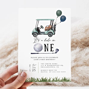May include: A golf-themed first birthday invitation featuring a green and white golf cart, a golf ball, and a golf club. The invitation reads "It's a hole in one" and includes the date, time, and location of the party.