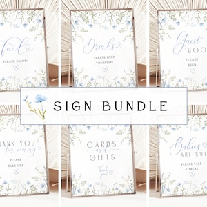 May include: A set of ten printable baby shower signs with a floral design featuring blue flowers and green leaves. The signs include text such as "Food", "Drinks", "Guest Book", "Thank You for Coming", "Cards and Gifts", and "Babies are Sweet".