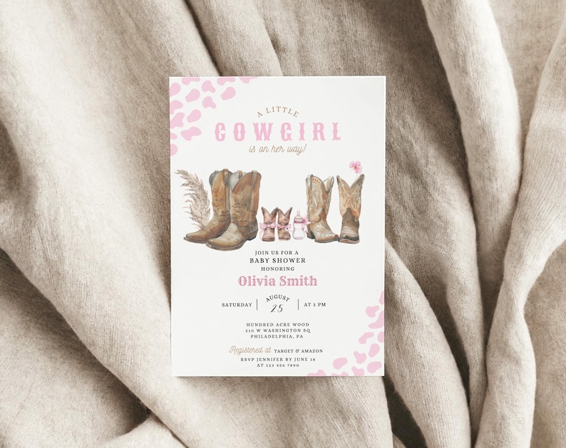 May include: A pink and white baby shower invitation with a watercolor illustration of cowboy boots and the text "A Little Cowgirl is on her way!"  Join us for a baby shower honoring Olivia Smith on Saturday, August 25th at 5 PM.  Hundred Acre Wood, 510 W Washington Sq, Philadelphia, PA. Registered at Target & Amazon. RSVP Jennifer by June 18th.