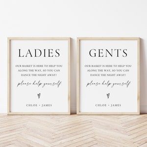 May include: Two framed signs with the words "LADIES" and "GENTS" in black text. Each sign includes the text "OUR BASKET IS HERE TO HELP YOU ALONG THE WAY, SO YOU CAN DANCE THE NIGHT AWAY!" and "please help yourself."