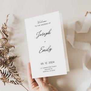 May include: A white wedding program with black text. The program says "Welcome to the wedding of Joseph + Emily" and includes the date "09. 12. 2024", the location "St. Cornerstone Church, Highland Rd, Norfolk, VA 20103".