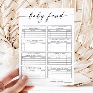 May include: A printable baby shower game called "Baby Feud" with eight questions and answer choices. The game is designed to be played by guests at a baby shower.