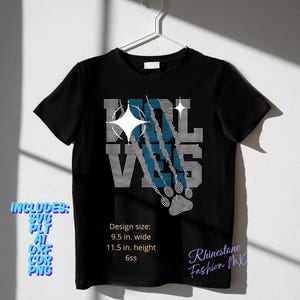 May include: Black t-shirt with a rhinestone design. The design features the word "WOLVES" with a paw print and claw marks. The design size is 9.5 inches wide and 11.5 inches high.