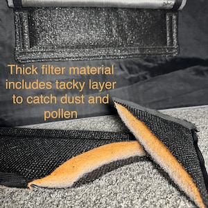 May include: Close-up of a black filter material with a brown sticky layer. The text "Thick filter material includes tacky layer to catch dust and pollen" is visible in the image.