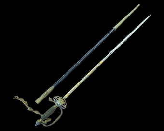 May include: An antique rapier sword with a decorative hilt and a slender, pointed blade. The sword features a gold-colored handle and guard, with a black scabbard. The sword is displayed against a black background.