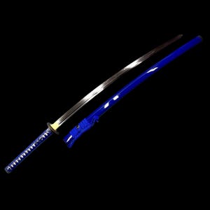 May include: A traditional Japanese katana sword with a blue and silver scabbard. The sword is sharp and has a curved blade.