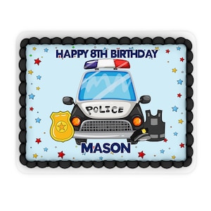 May include: A rectangular cake decorated with a police car, badge, and vest design. The cake has a light blue background with stars and the text "HAPPY 8TH BIRTHDAY MASON". The border is black.