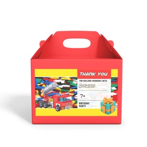 May include: Red and yellow favor box with a thank you label. The label has a picture of a toy truck and the text "Thank You for building memories with Rowan 7+ Birthday Party".