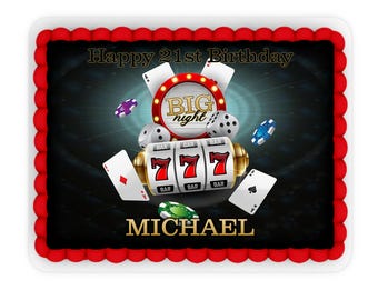 Può includere: Una torta nera e rossa a tema casinò con una grafica di slot machine, le parole "Happy 21st Birthday" e "BIG night", e il nome "MICHAEL".