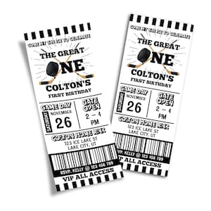 May include: Two black and white ticket-style invitations for a first birthday party. The invitations feature a hockey stick and puck with the text "The Great One" and "Colton's First Birthday". The invitations also include the date, time, and location of the party.