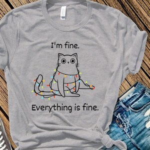 I'm Fine Christmas T-Shirt; Funny Christmas Tee; Cat Christmas T-Shirt; Christmas Lights Tee; Gifts for Cat lovers; Cat Holiday T-Shirt;