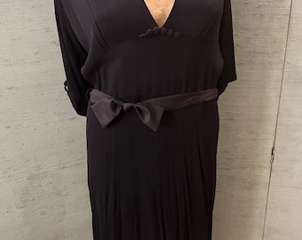 1940 crepe, bias cut dress in black with sash belt.