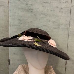 1940 wide brimmed, black straw hat with pink flowers