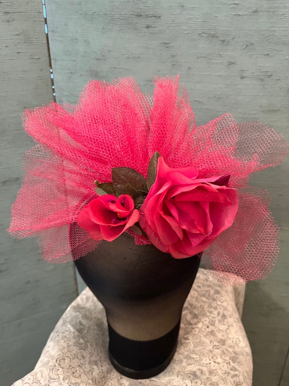 Vintage Fascinator hat in shocking pink net on a s