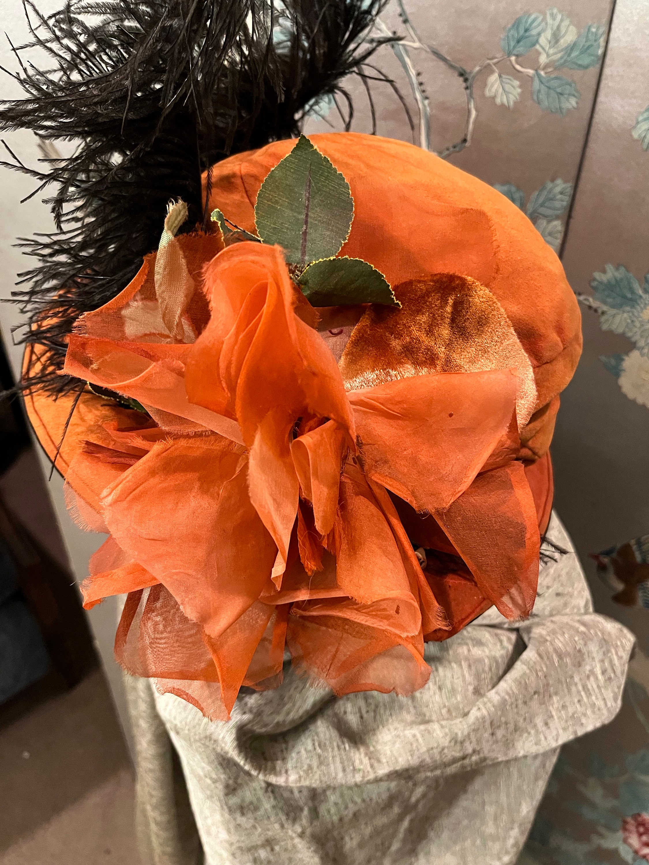 Black and Orange Feathered Floral Dress Hat This black hat showcases an abundance of beauty. The  main image 3