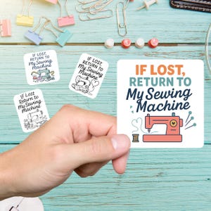 May include: A hand holding a square sticker with the text "IF LOST, RETURN TO My Sewing Machine" above a red sewing machine illustration. Three smaller stickers with similar designs are scattered around.