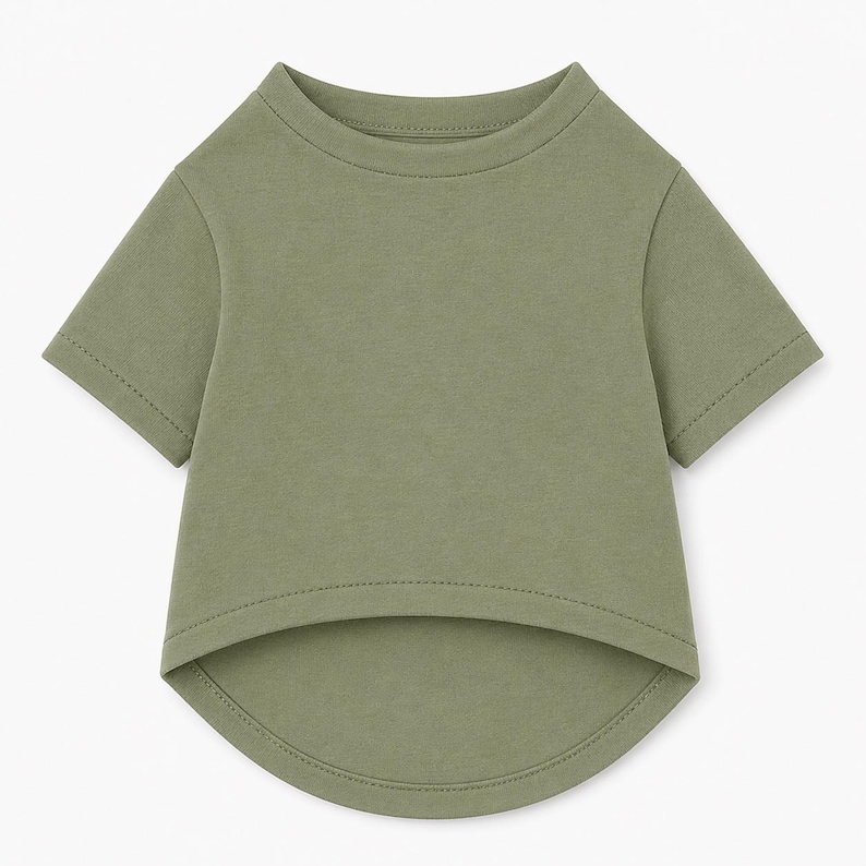 May include: A solid olive green short-sleeved shirt featuring a crew neckline and a high-low hemline. The garment is constructed with a smooth, plain fabric and includes visible stitching along the sleeves, neckline, and the curved bottom hem.