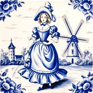 May include: A blue and white ceramic tile with a depiction of a woman in a blue dress and a white hat standing in front of a windmill. The tile has a white background with blue floral designs in the corners.