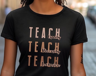 May include: A black t-shirt with the words "Teach Equity", "Teach Diversity", and "Teach Inclusion" printed in brown on the front.
